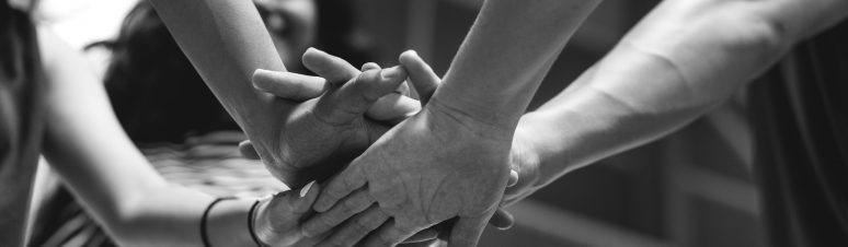 group-of-teenager-friends-on-a-basketball-court-teamwork-and-togetherness-concept